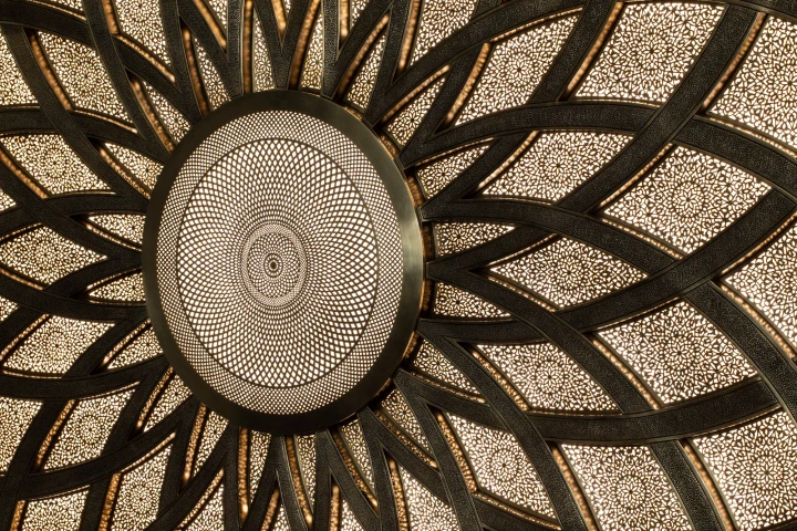 Upward view of a mandala with radiating petal-like ribs around a finely perforated centre, Mandala 818 series.