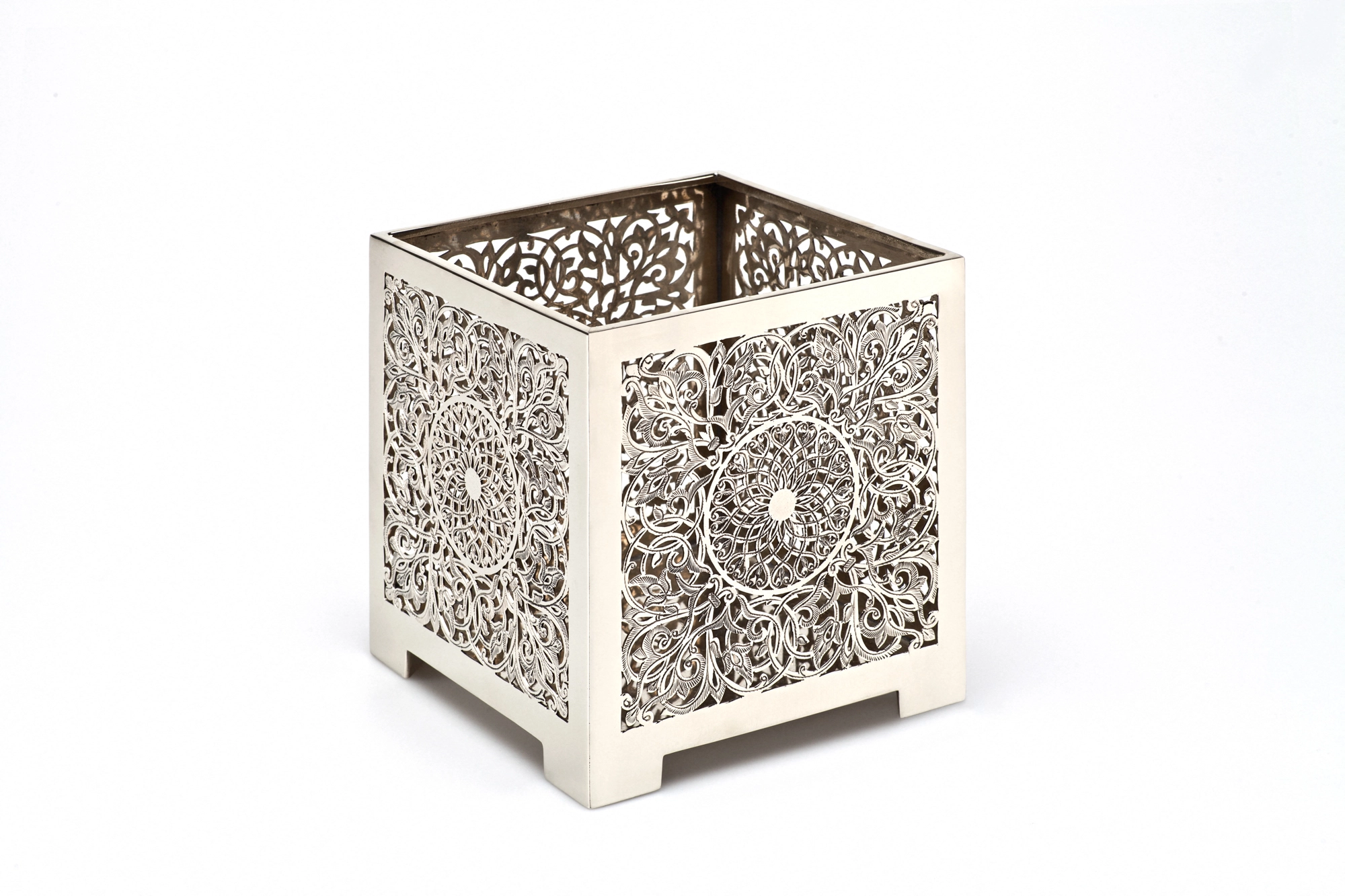 A square pierced metal candle box with a white floral openwork finish, shown against a white background.
