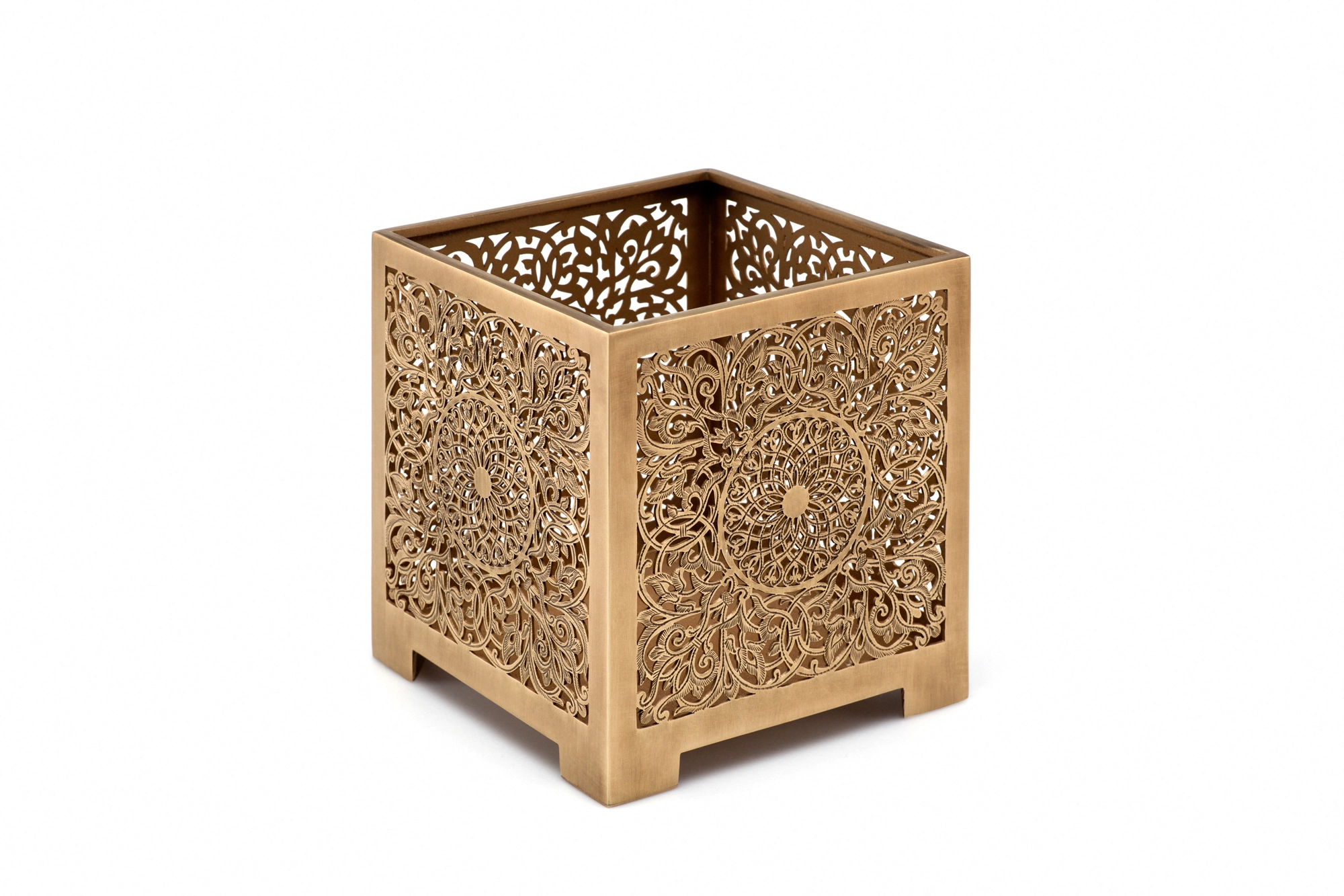 A square pierced metal candle box in brass with floral openwork, photographed against a white background.