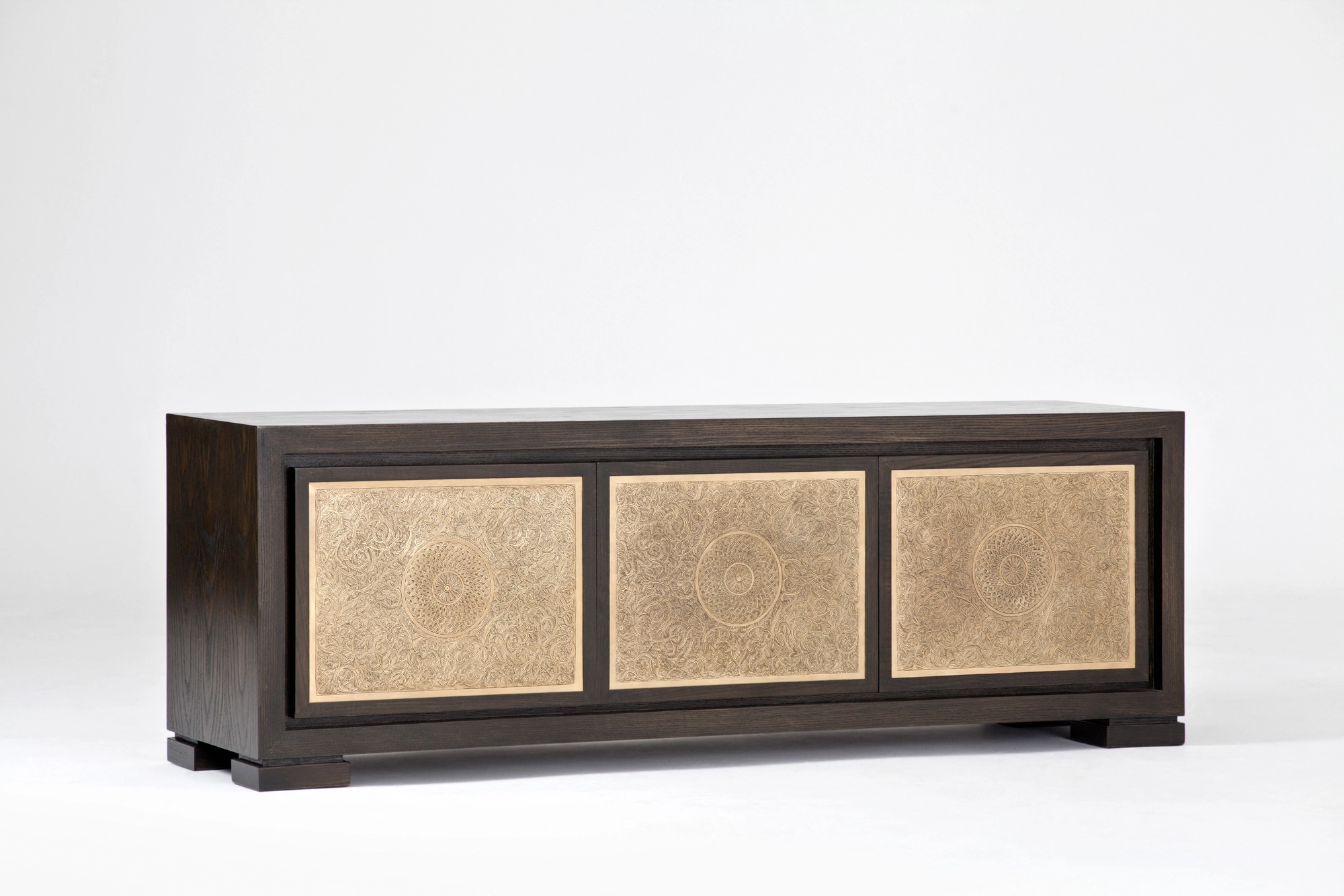A dark wood sideboard fronted with three pale patterned inset panels, photographed against a white background.